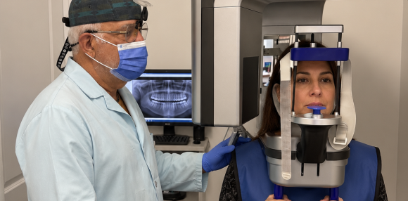 Patient positioned for a panoramic dental scan