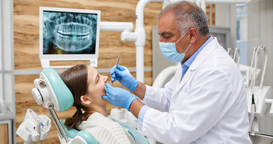 Dentist examining a patient